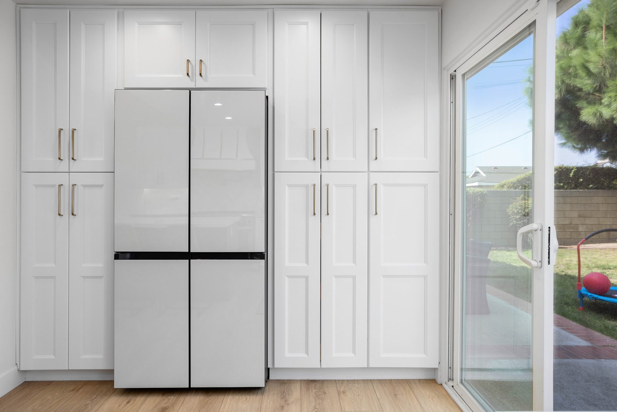 Brass-Accented White Kitchen Remodel — Houston, TX photo 17