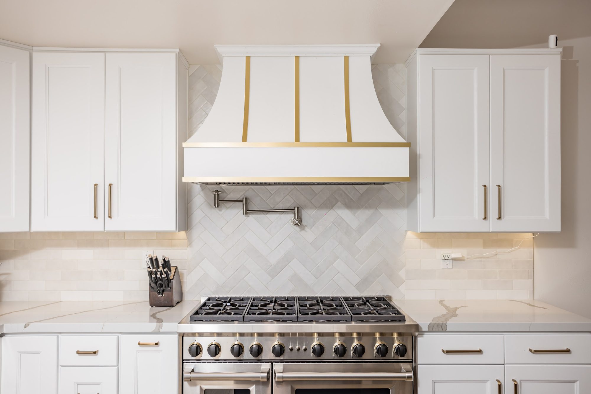 Brass-Accented White Kitchen Remodel — Houston, TX photo 8